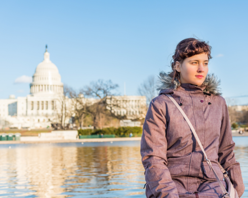 Woman standing in front of the U.S Capitol Building